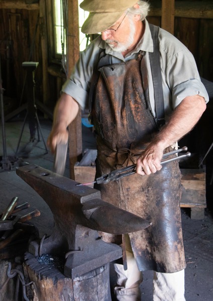 Blacksmith working on the anvil 2000